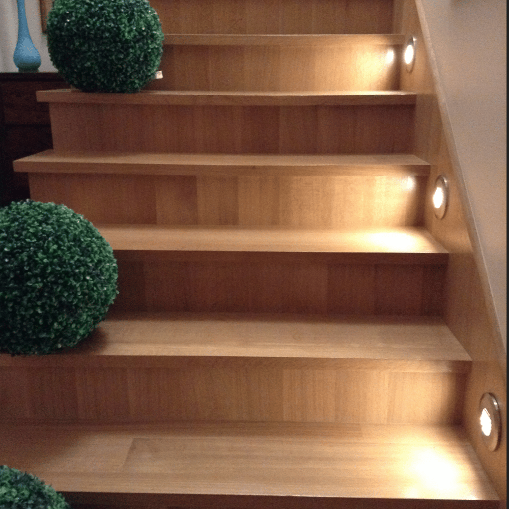 Custom wood staircase with fitted treads, risers and integrated step lighting